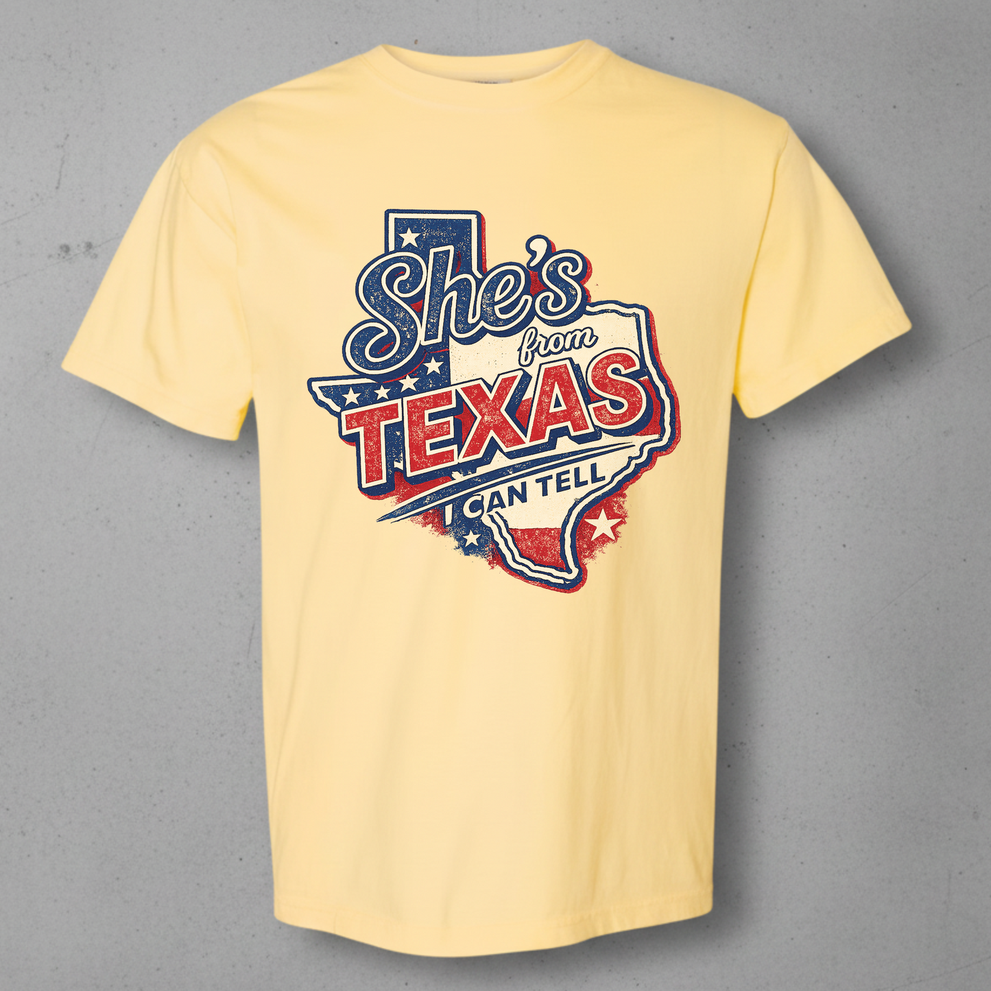 Butter Comfort Colors shirt with the red white and blue she's from Texas design