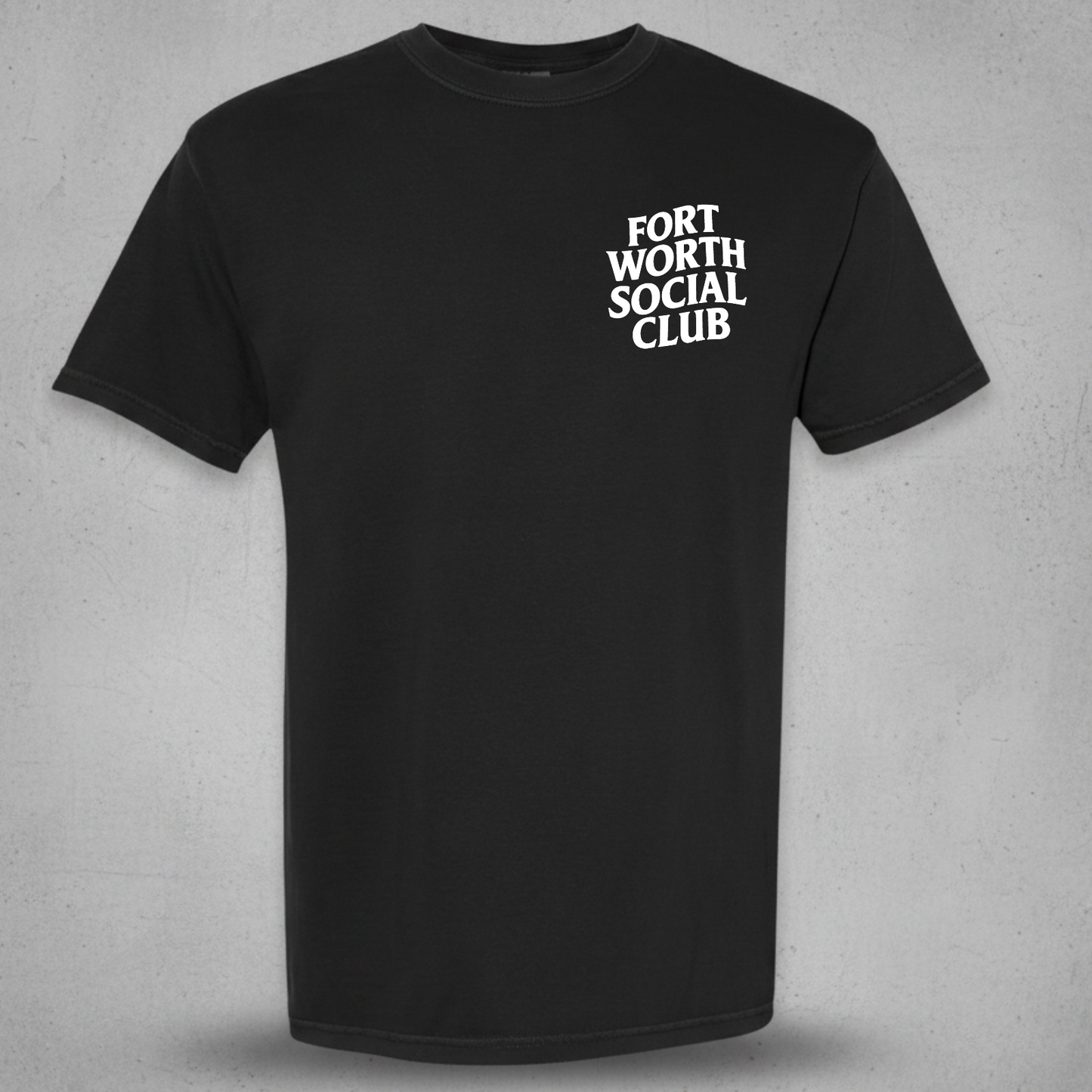 A black short-sleeve crewneck t-shirt with the text 'FORT WORTH SOCIAL CLUB' printed in white stacked letters on the left chest, displayed against a textured gray background.