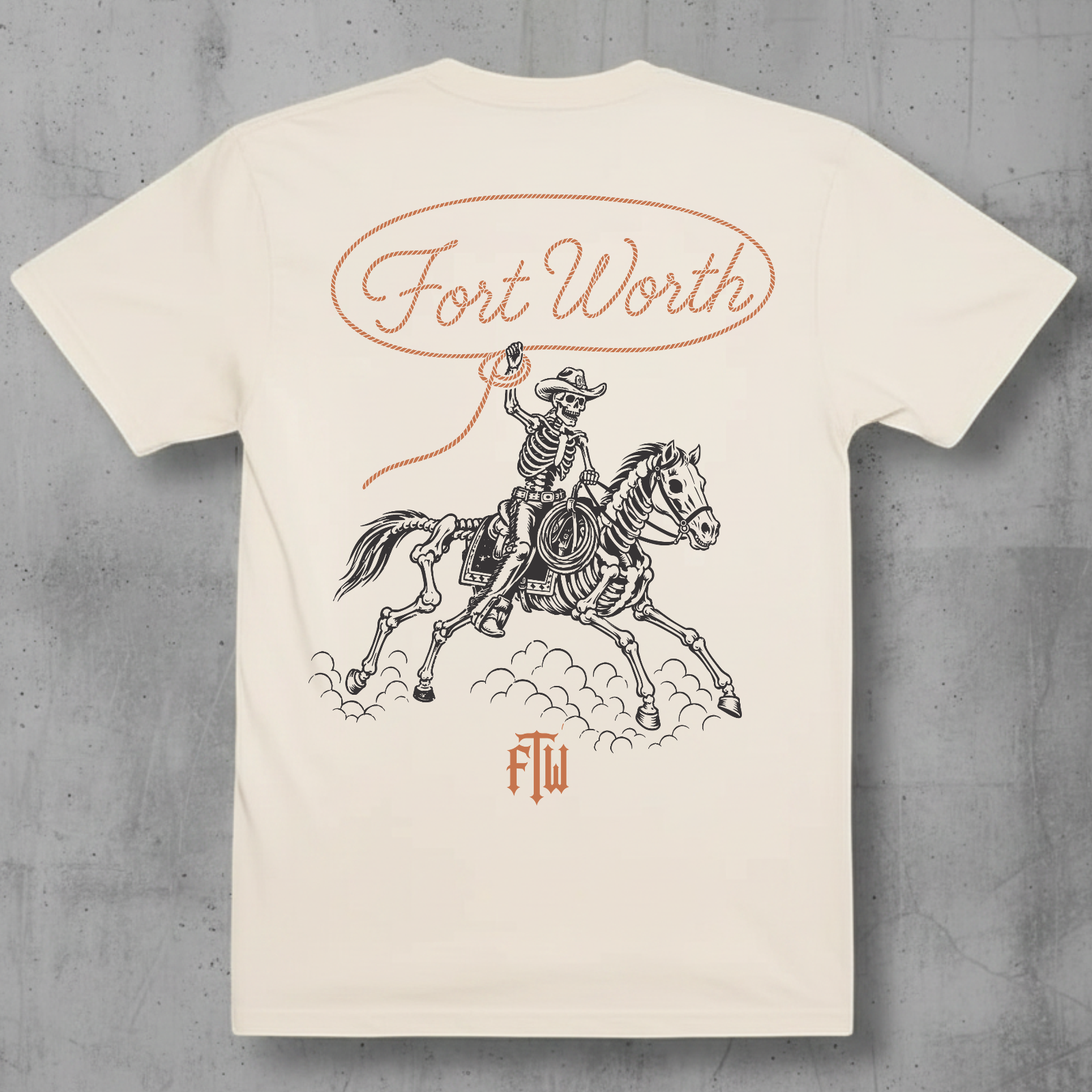Skelton cowboy and horse with a lasso that reads Fort Worth on a ivory t-shir 