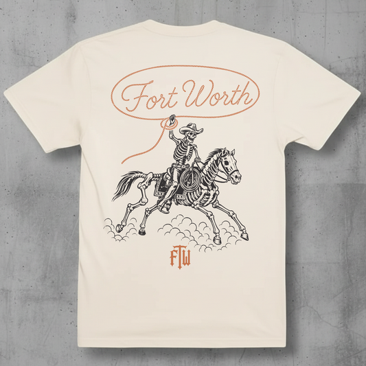 Skelton cowboy and horse with a lasso that reads Fort Worth on a ivory t-shir 