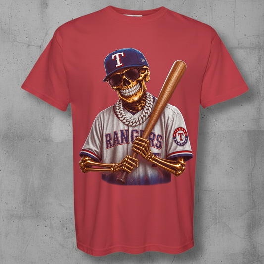 A red short-sleeve crewneck t-shirt featuring a detailed graphic of a skeleton baseball player wearing a Texas Rangers jersey and holding a bat, displayed against a textured gray concrete background.
