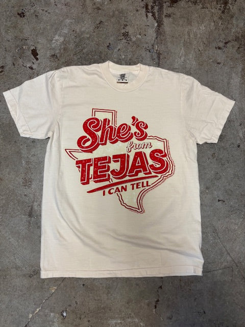 Ivory Comfort Color t-shirt with red graphic design on a concrete surface