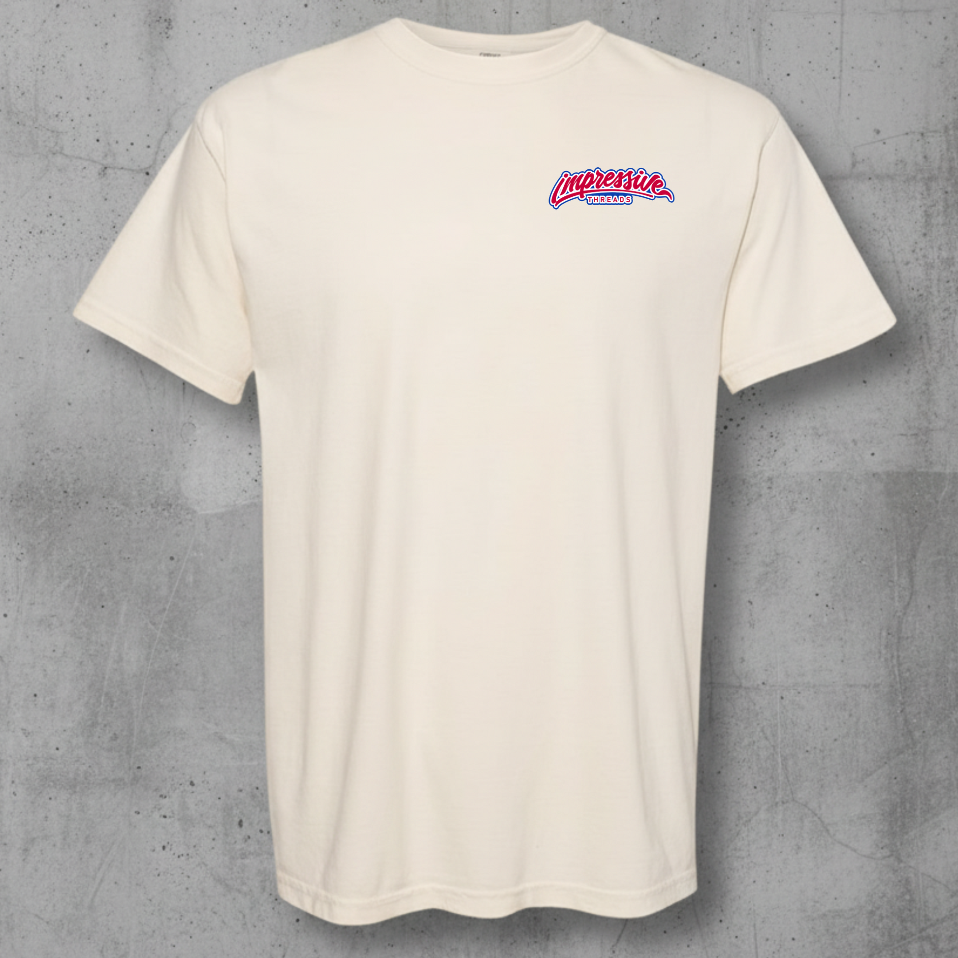 ivory  t-shirt with impressive threads on a gray concrete background